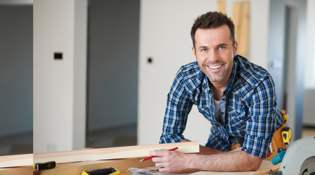carpenter smiling at camera-1080x600